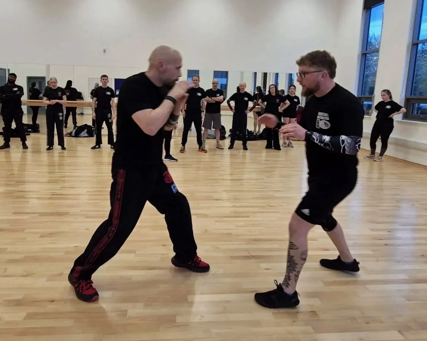 Instructors demo staying relaxed until moment of contact.